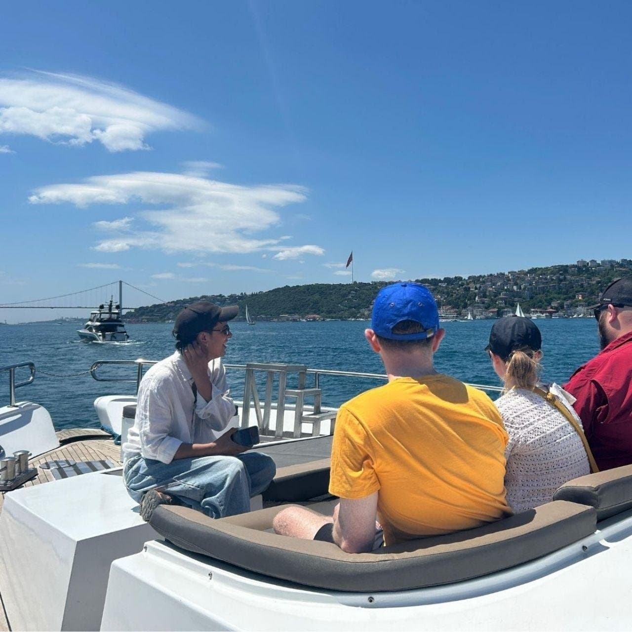 Guests on the open deck taking in the Bosphorus with the guide