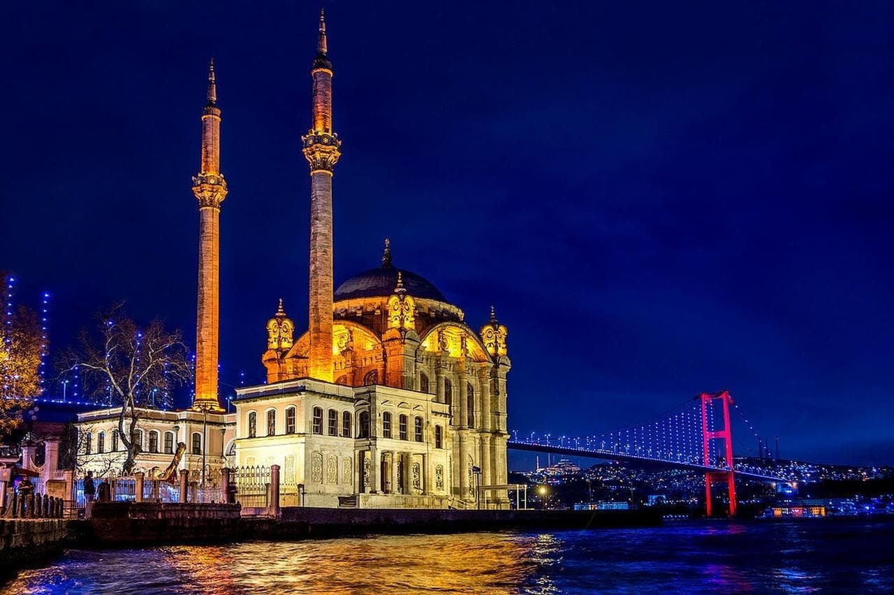 The Ortaköy Mosque and the Bosphorus Bridge illuminated at night
