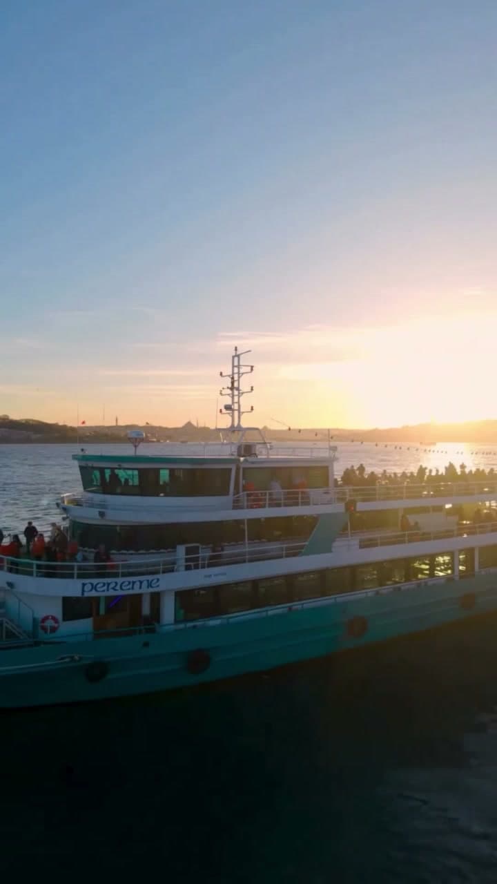 The Pereme Bosphorus tour boat with passengers on deck at sunset