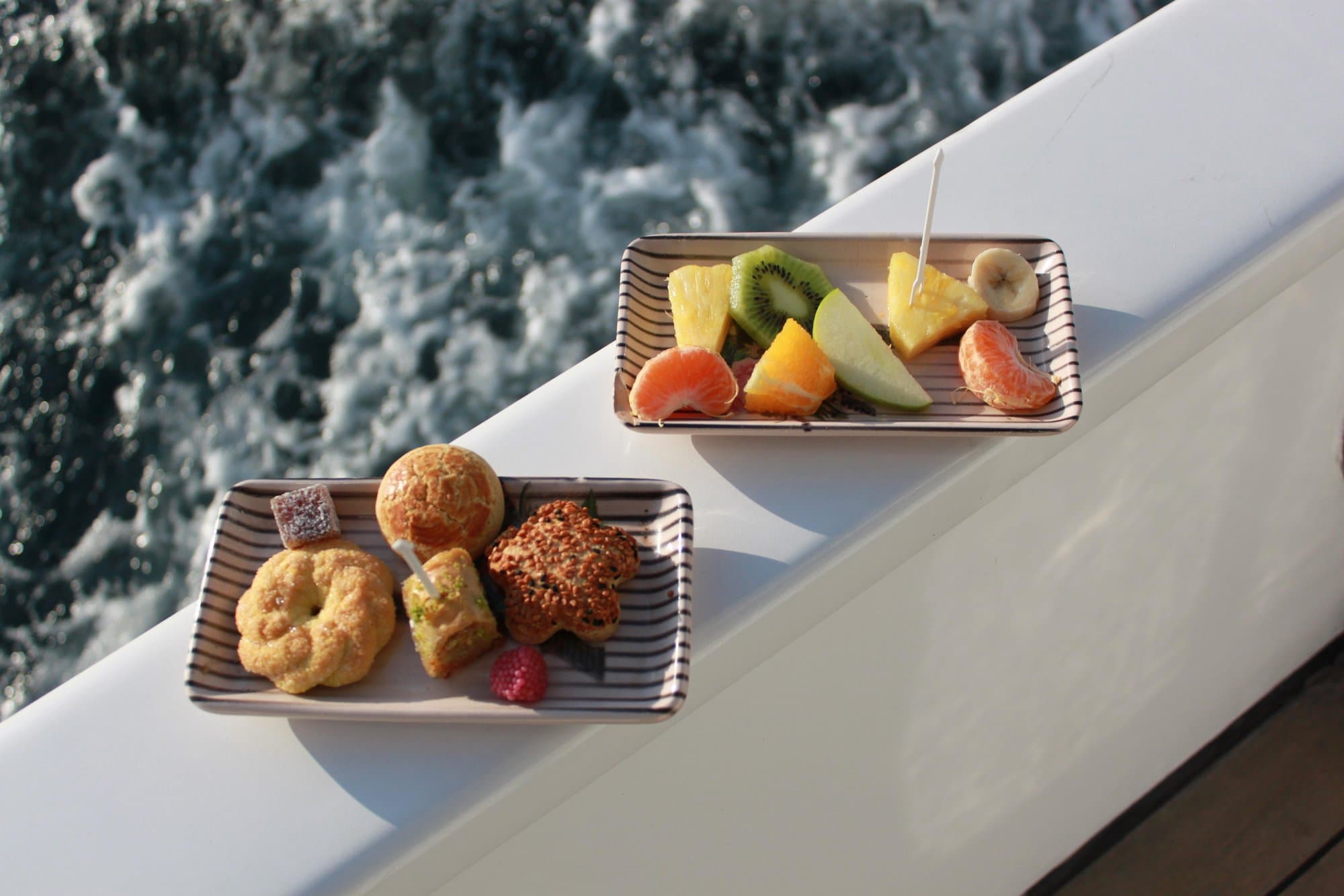 Plates of canapés and fresh fruit served on board the cruise