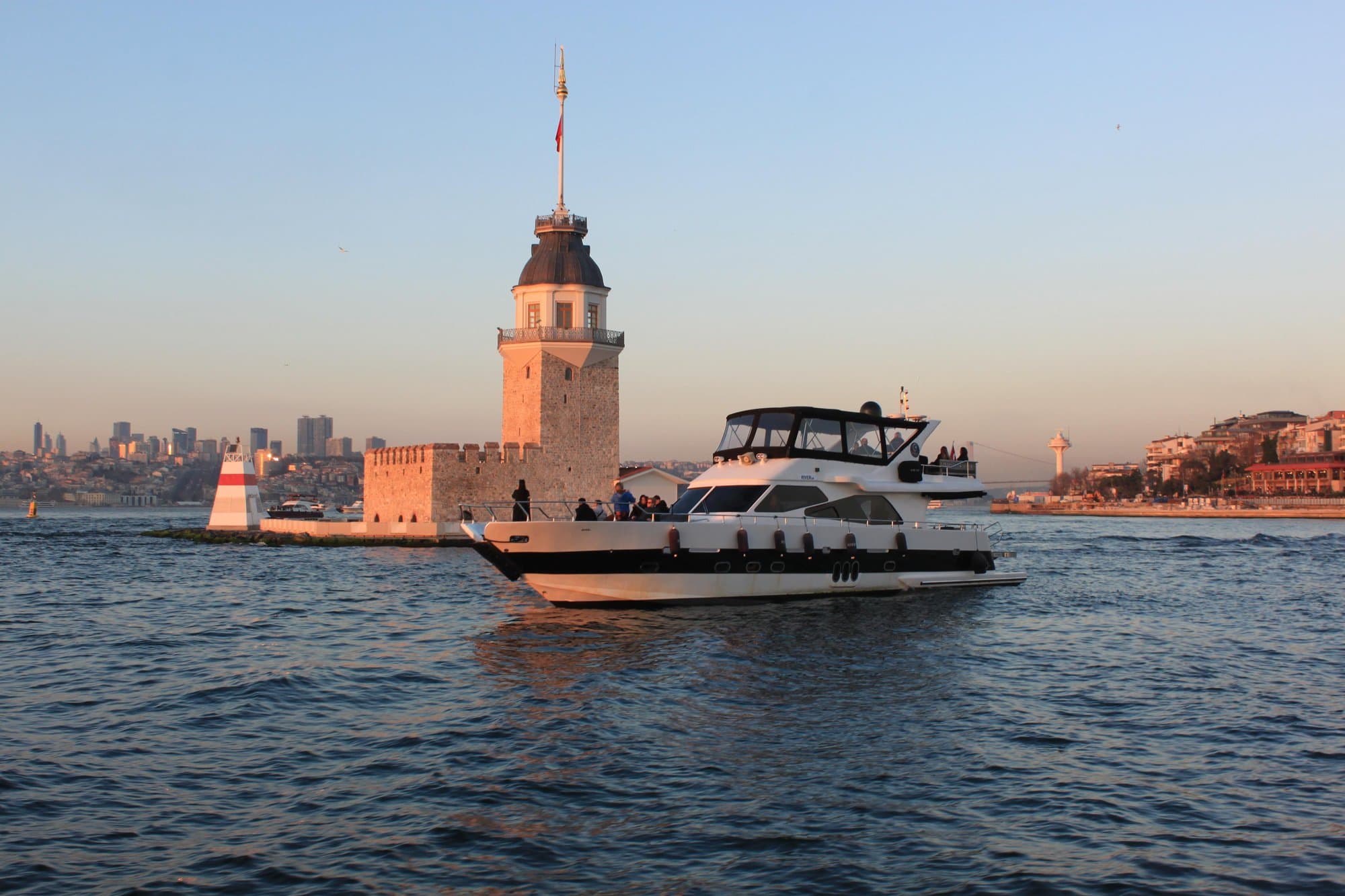 The cruise yacht passing the Maiden's Tower in the evening light